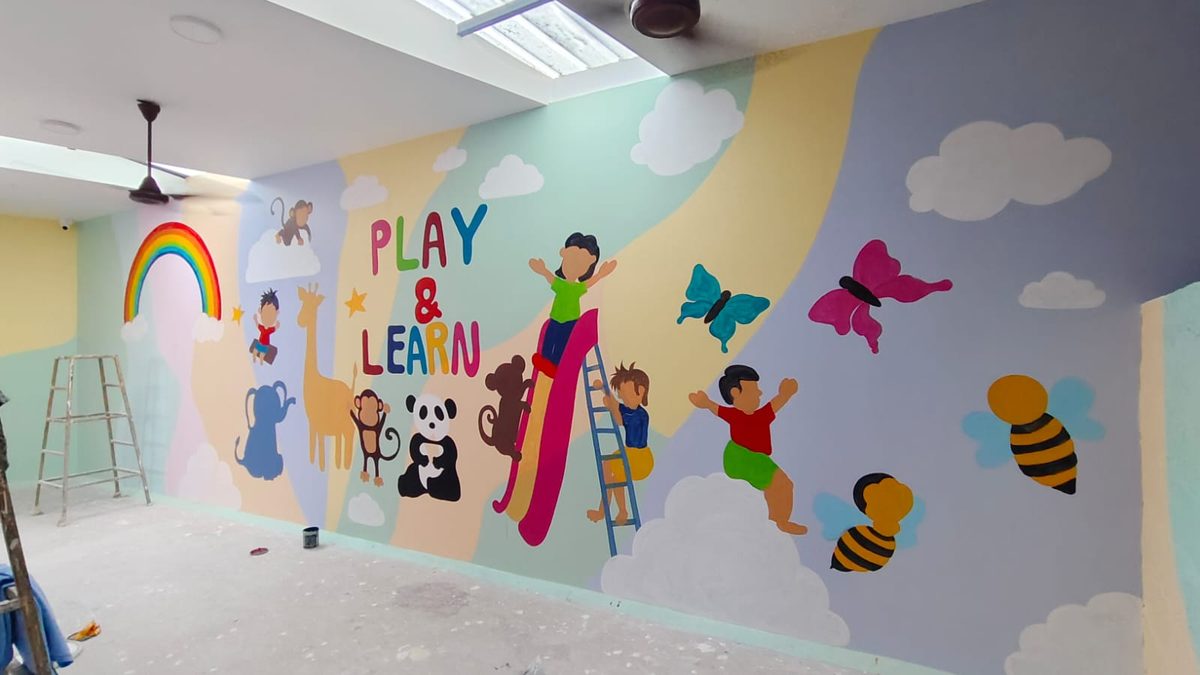 Colourful kids' playroom mural with rainbow, animals and a slide
