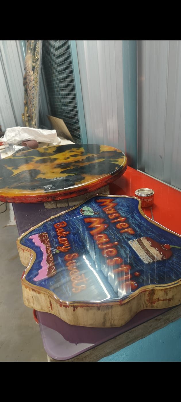 Custom shaped wood signage board painted and epoxy-coated for a bakery and sweets shop