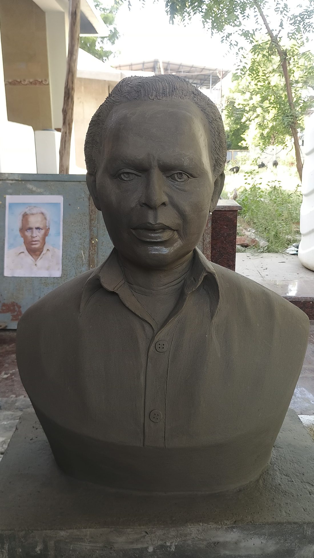 Cement-finish memorial bust sculpture of an elderly man